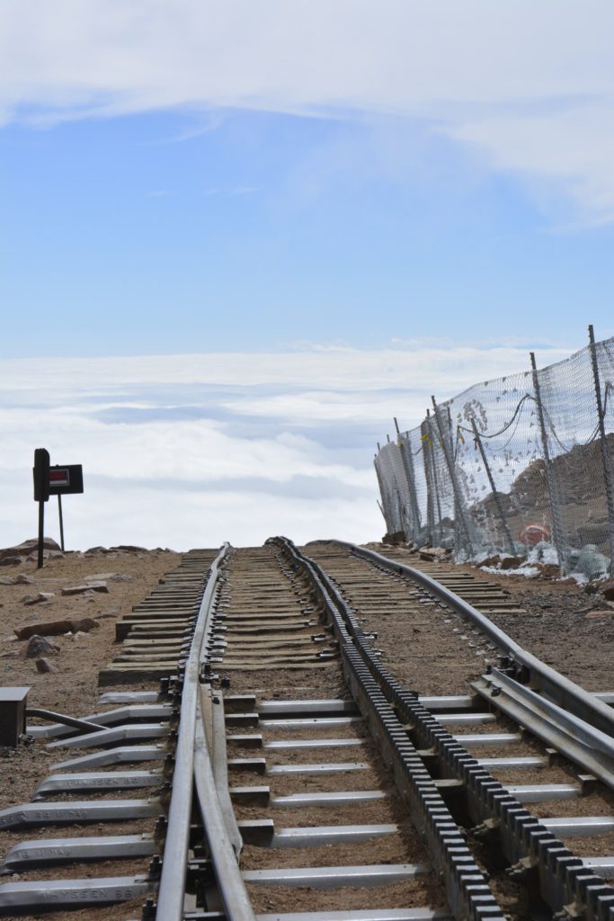A train track leading up to the top of a mountain.