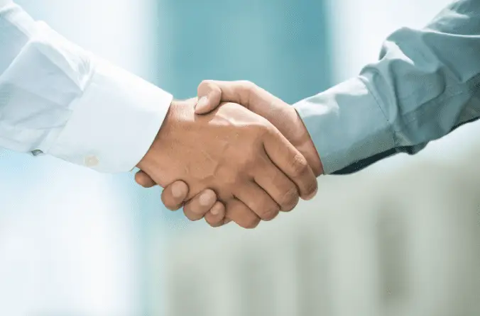 Two hands shaking in agreement.