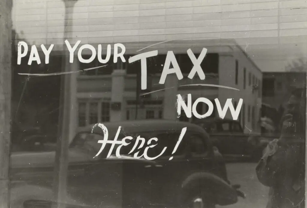 "Sign: Pay your tax now here!"