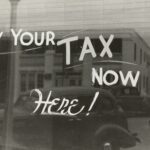 "Sign: Pay your tax now here!"