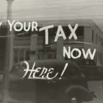 "Sign: Pay your tax now here!"